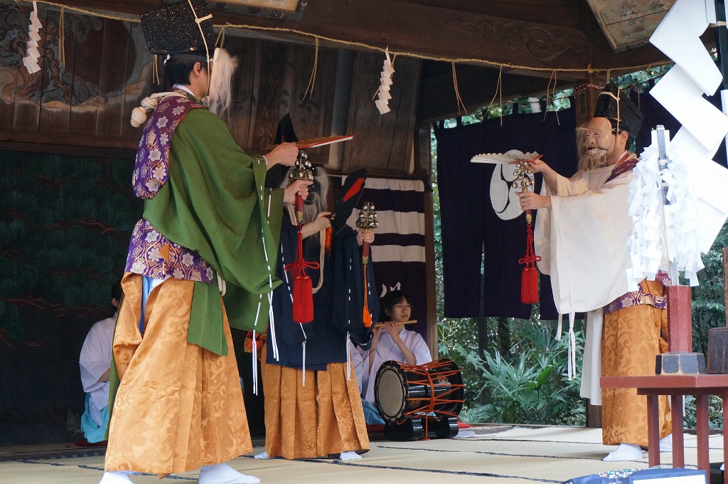 3 players onthe stage of kagura (Japanese traditional performing art)