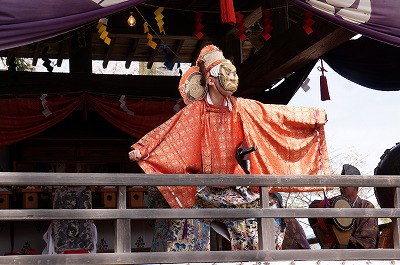 a deity dances in kagura (Japanese traditional folk performing art)