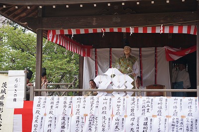 an archer is on the stage of kagura (Japanese traditional folk performing art)