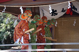 four men are dancing in kagura (Japanese culture)